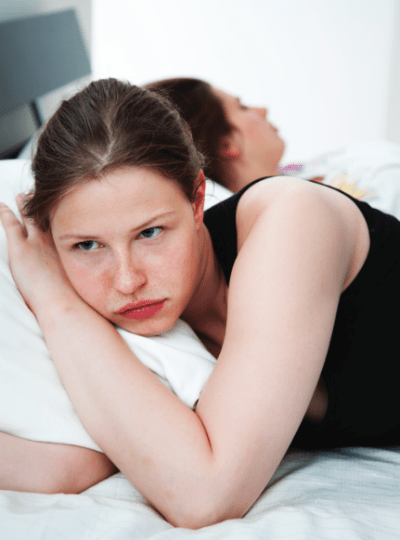 2 women in bed lying back to back 2 women in bed lying back to back