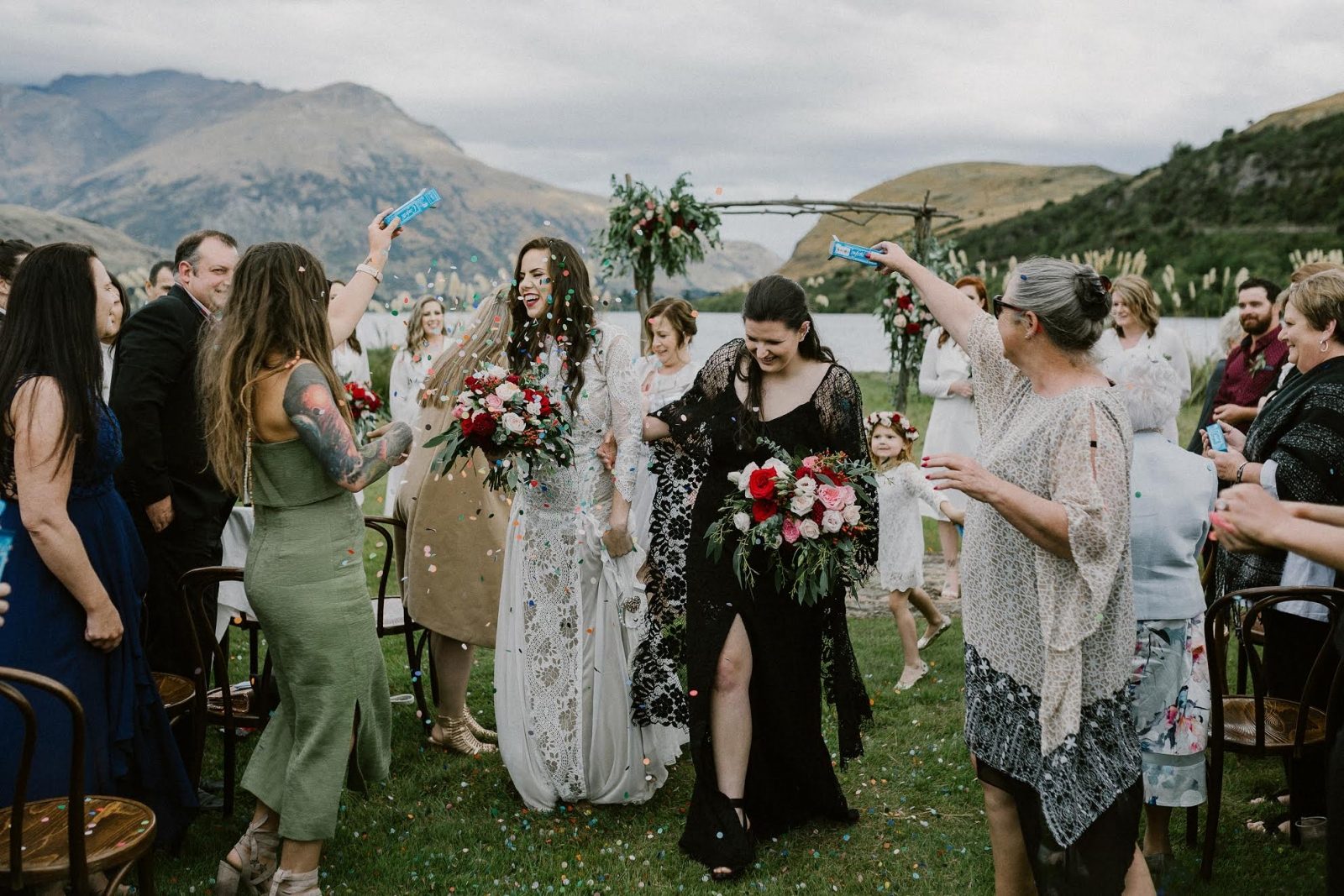 lesbian wedding photo next to a lake lesbian wedding photo next to a lake