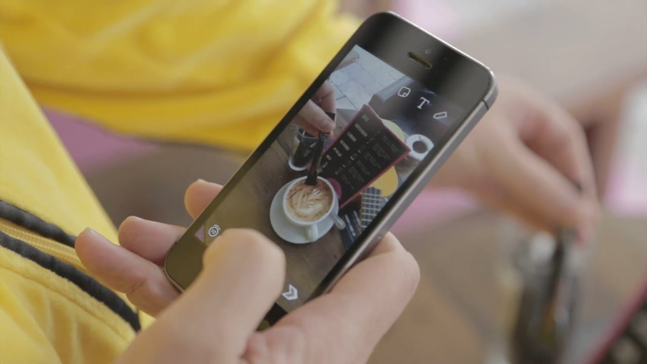 womans hand using a mobile phone womans hand using a mobile phone